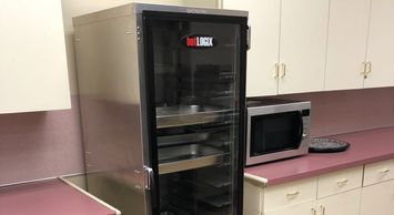 Warmer, Microwave and Cabinets in Kitchen