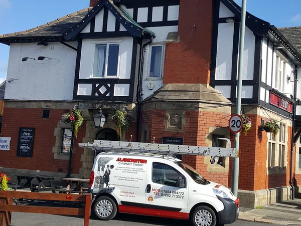 J. Lancaster chimney sweep services van