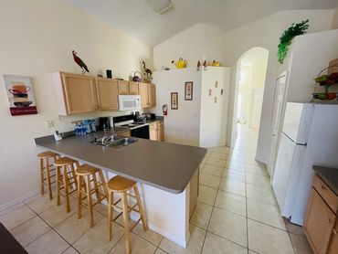 Florida Vacation Villa. Open plan kitchen seating area.