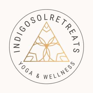 Elegant logo for Indigo Solretreat Yoga & Wellness in soft gold and black.