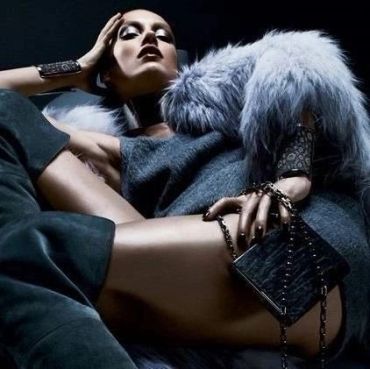 Fashionable woman in luxurious fur and accessories.