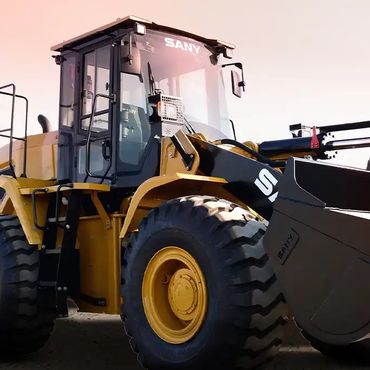 Yellow SANY wheel loader with a large bucket in a desert setting.