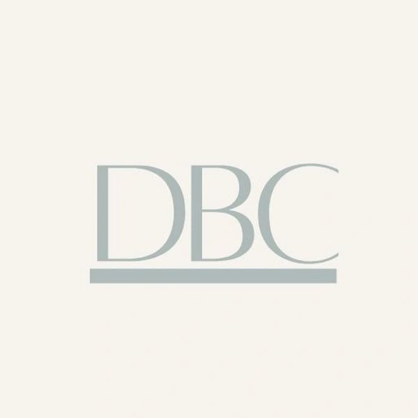 Minimalistic logo with letters DBC and an underline in muted gray.