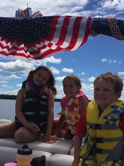 Kids enjoying a pontoon ride. 