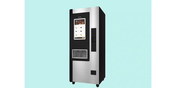 Sleek modern coffee vending machine with touchscreen interface.