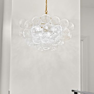 Elegant chandelier with glass globes.