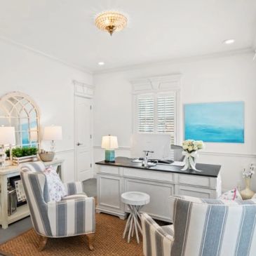 Bright and cozy home office with striped armchairs.
