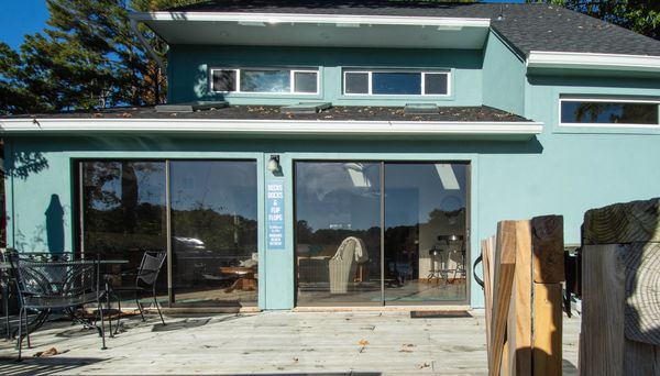 Sliding glass doors that lead out onto the deck.