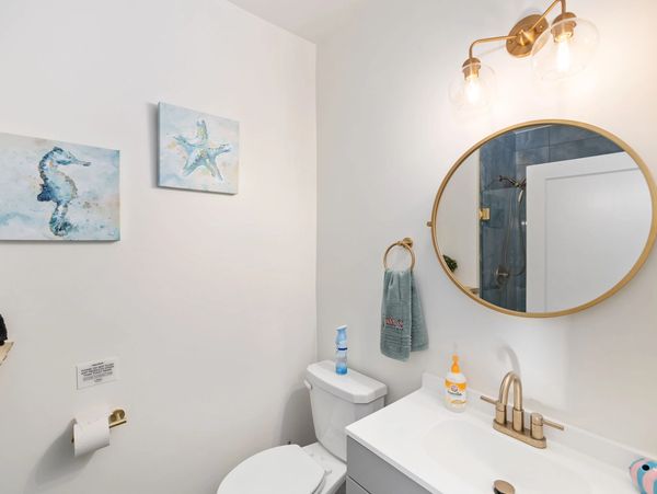 Downstairs guest bathroom with shower.