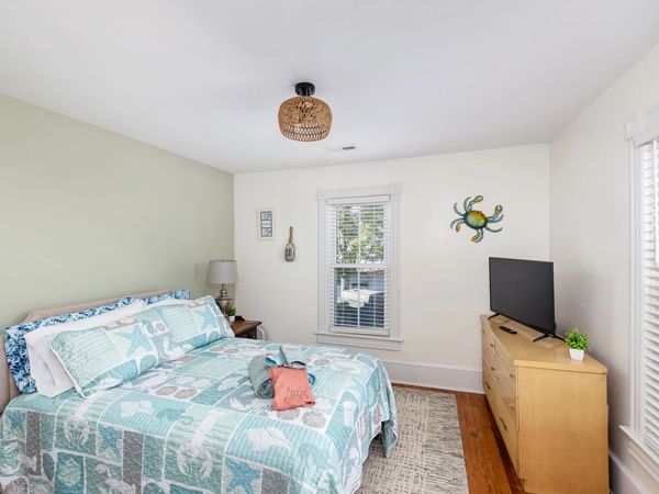 upstairs bedroom with full bed and smart tv