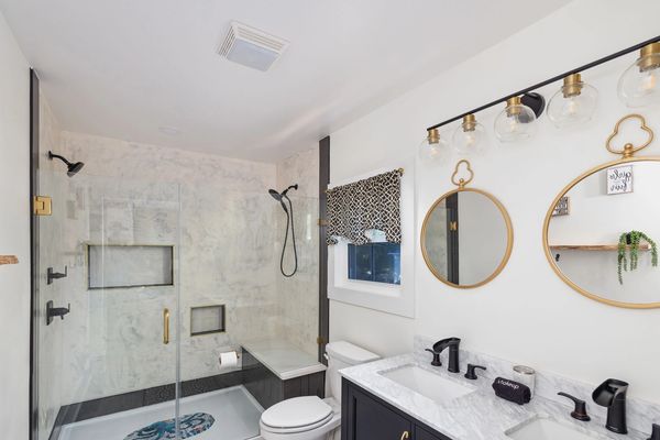 Upstairs primary bathroom with custom stucco shower.