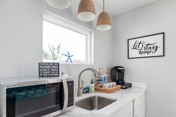 Kitchenette located in upstairs living room for guest convenience