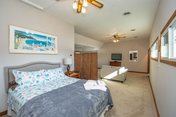 View of upstairs bedroom from queen bed in the corner.