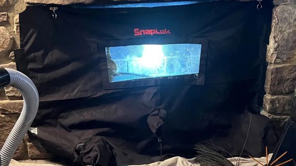 Snacklock cover on fireplace front while sweeping chimney to protect home in Harrisonburg VA