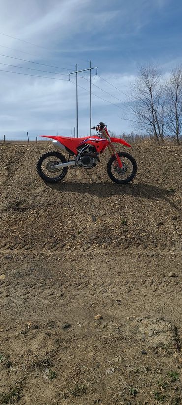 dirt bike stand on steep hill