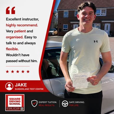 Smiling young man holding driving test pass certificate next to a car.