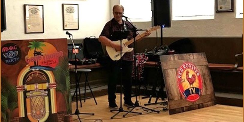 Gene Thorpe playing electric guitar as a solo entertainer indoors.