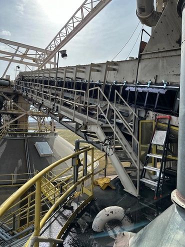 Coal Conveyor Skirting Installation on 130 foot tall silos