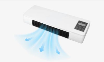 Wall-mounted air conditioner blowing cool air with digital control panel.