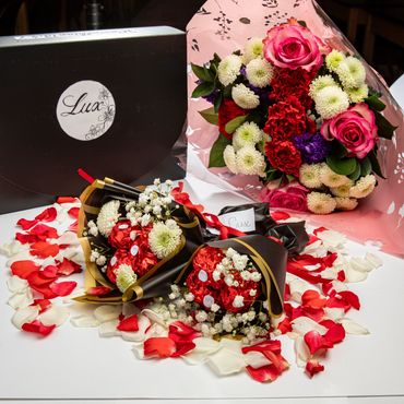 Indulge in the timeless story of love with our Romance Collection chocolate box.
**Bouquet of flower