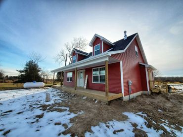 Image of the front of the two story home the Brandi Marie.