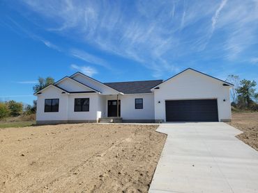 Photo of front of the house plan the river view ranch.