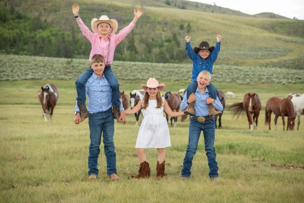 fun family photo sessions with horse on location of your choice: Colorado family portraits w horses
