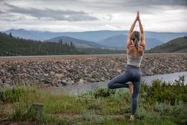 commercial photography advertising photo for yoga studio: outdoor with Mountain View yoga session