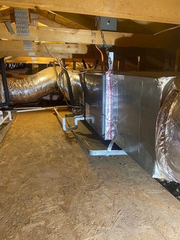 HVAC installation with ducting in the attic.
