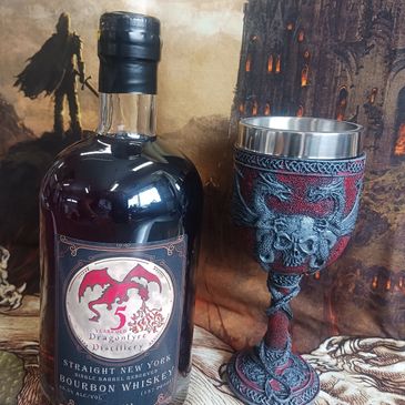 bottle and chalice with castle background