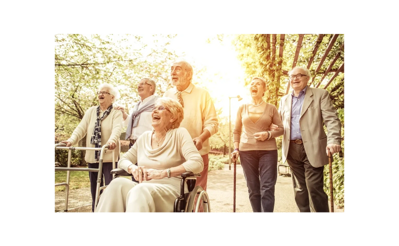 Group of friends joyfully walking outdoors on a sunny day.