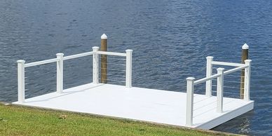 white dock with wire and post handrail