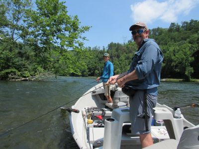 Spinner fishing from a drift boat on the Hiwassee river near Reliance, Tn