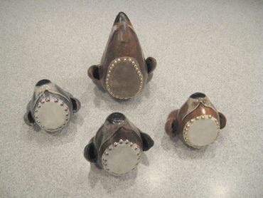 4 Dog head drums showing the drum heads