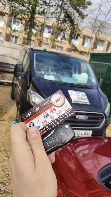 "Emergency car locksmith unlocking a Ford in London."