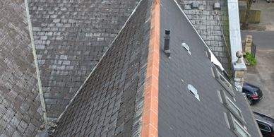 Comparison of two different roof styles on adjacent buildings.