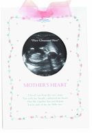 White card with a pink bow and circular cutout of a sonogram, labeled "MOTHER'S HEART" in pink.