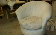 One of a set of barrel back chairs