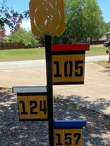 Unique mailbox with house numbers 105, 124, and 157.