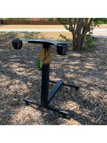 Metal drink holder stand with cup holders in an outdoor setting.