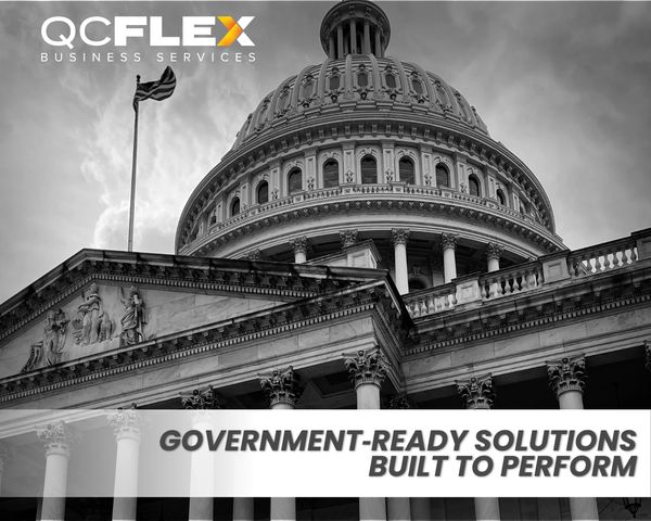 Government building with QCFlex logo and tagline about solutions.