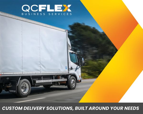 A delivery truck on a highway with QC Flex Business Services branding.