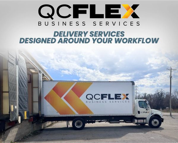 QC Flex Business Services delivery truck parked at a loading dock.