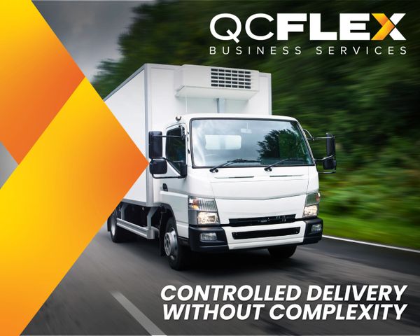 White delivery truck on road with QCFLEX business logo and slogan.