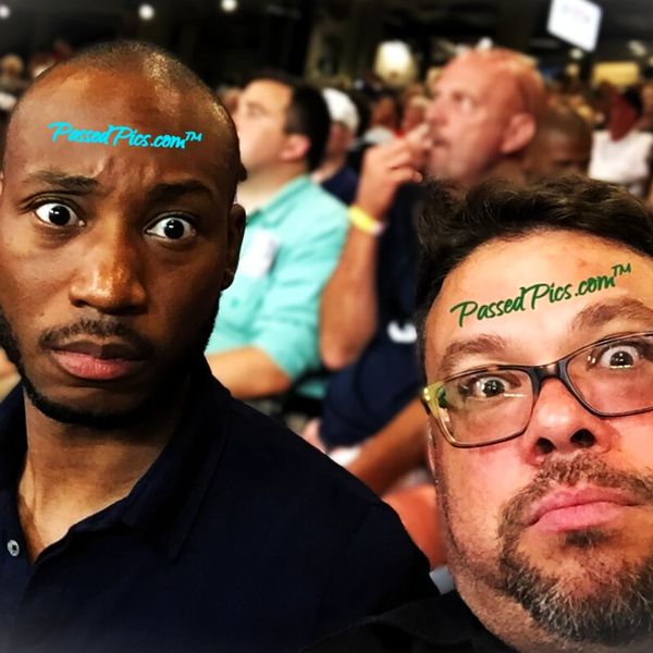 Lawrence & Joe curiously gazing into the camera at a Braves game at Truist Park in Atlanta Georgia.