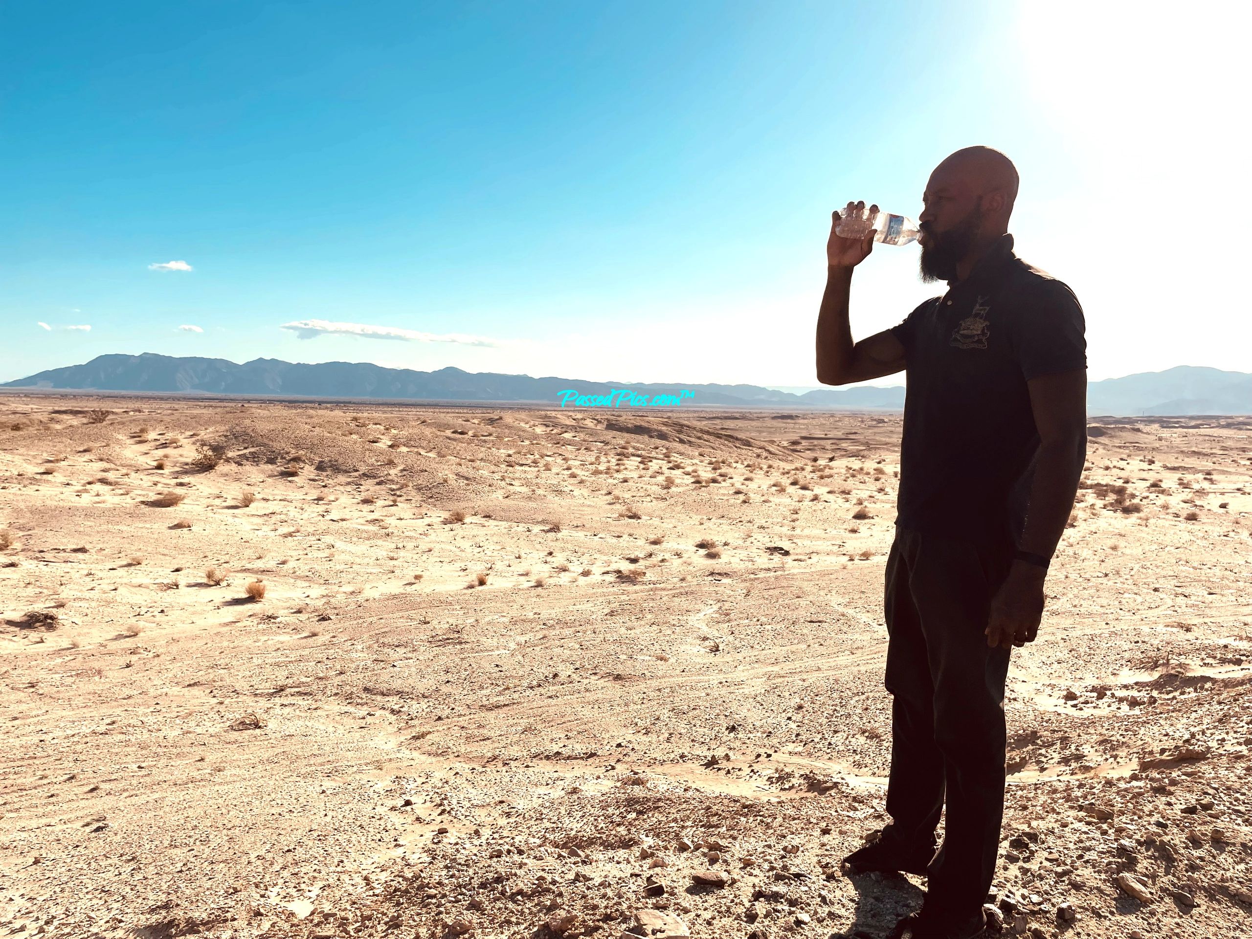 Lawrence, owner of PassedPics, alone in the desert under the sun with half a bottle of water.