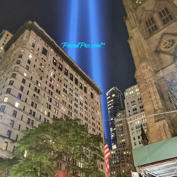 Ground Zero September 11th 9/11 Tribute with Lights shining towards the sky at Wall St & Broadway
