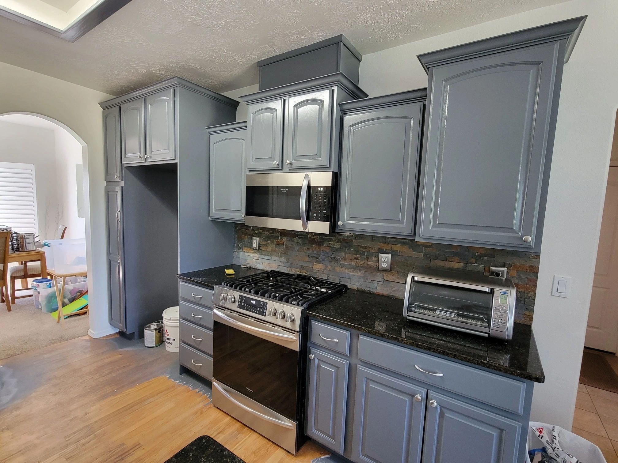 After picture of kitchen cabinets that we painted in blue gray.