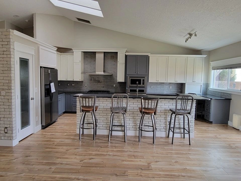 After picture of a kitchen that we painted in bright white and ash gray.