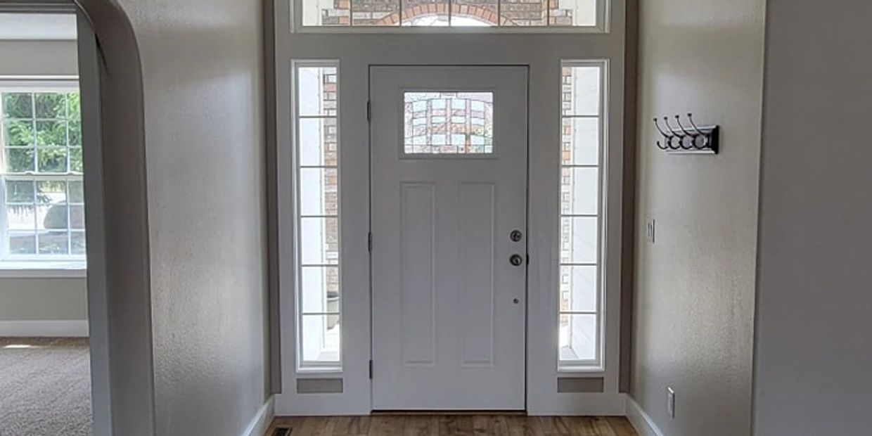 Interior entryway and door painted bright white.